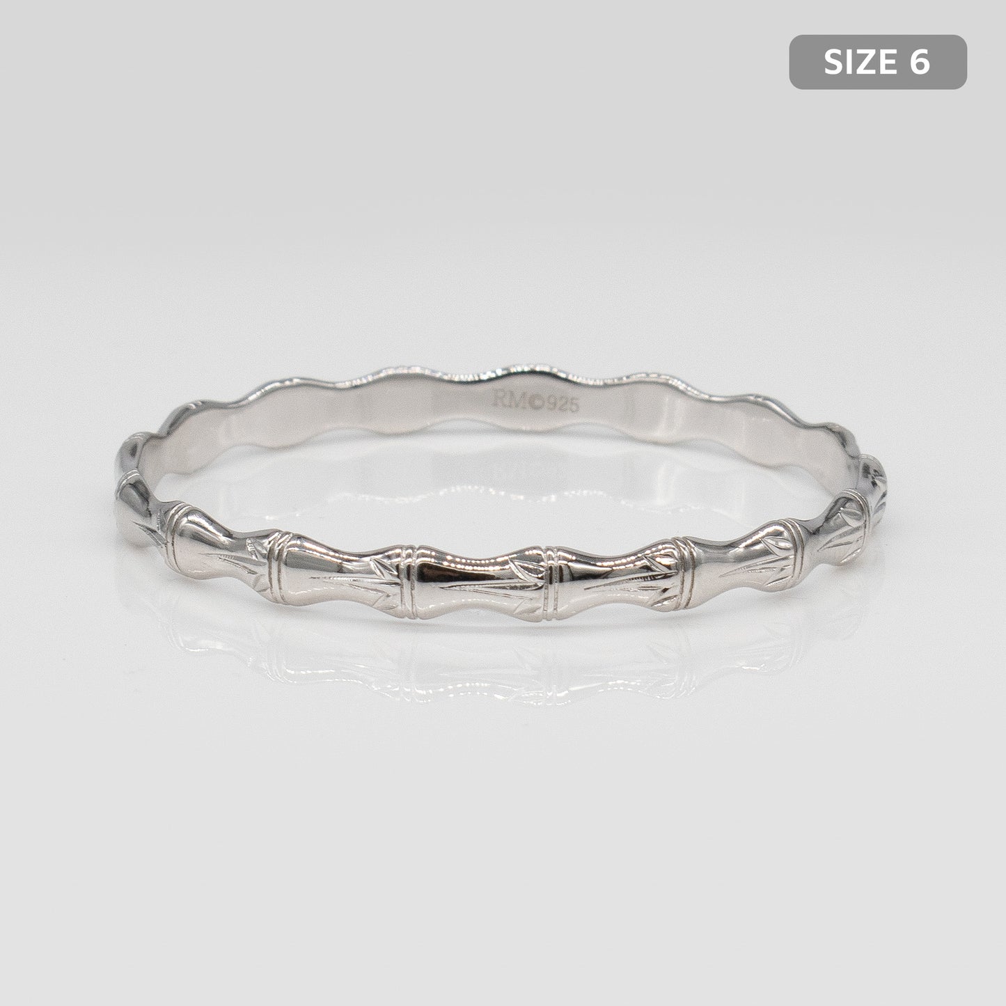 Kids Sterling Silver and Rhodium Bamboo Design Rosa Bangle. Size 6.